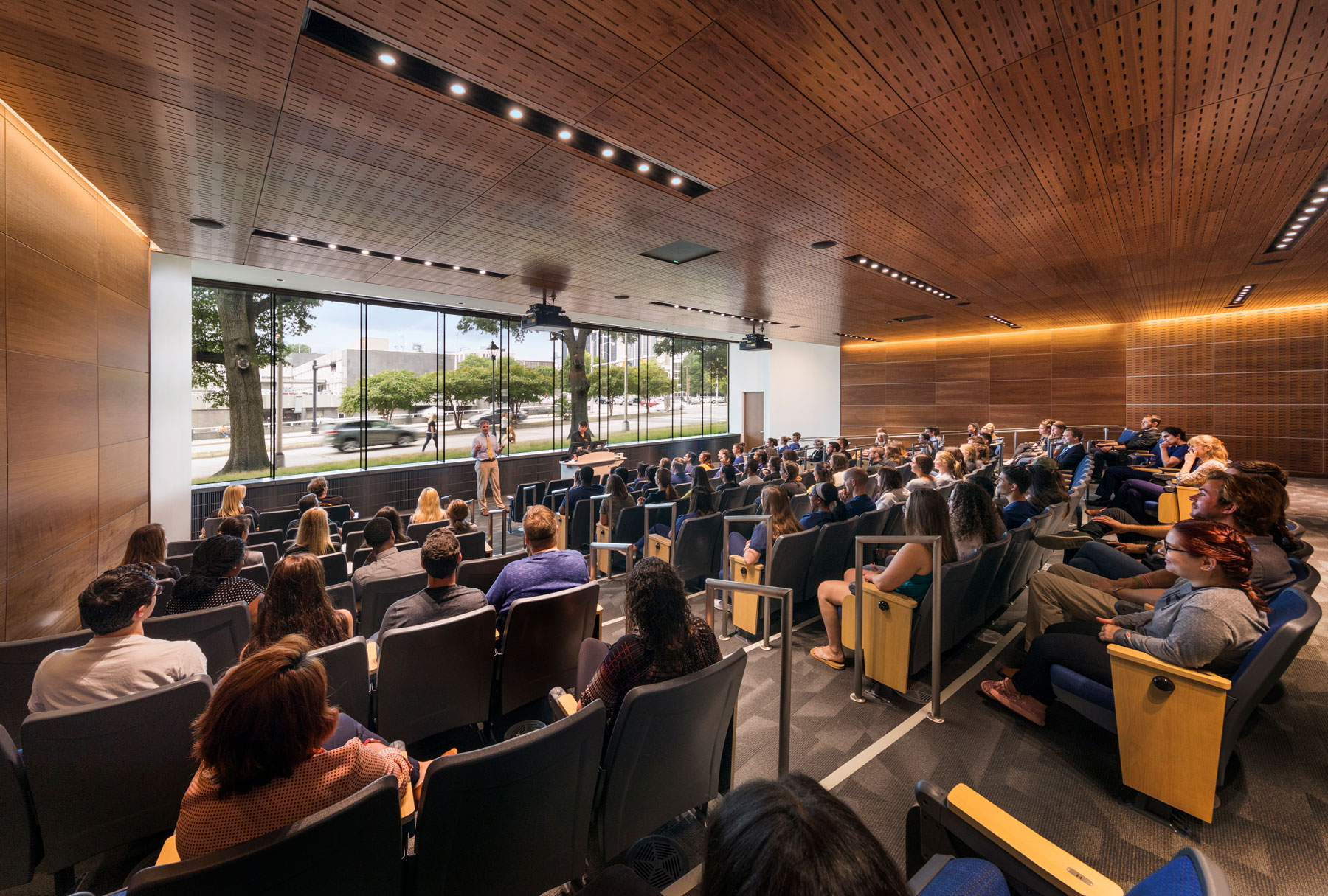 Students listen to a lecture in the main auditoruim