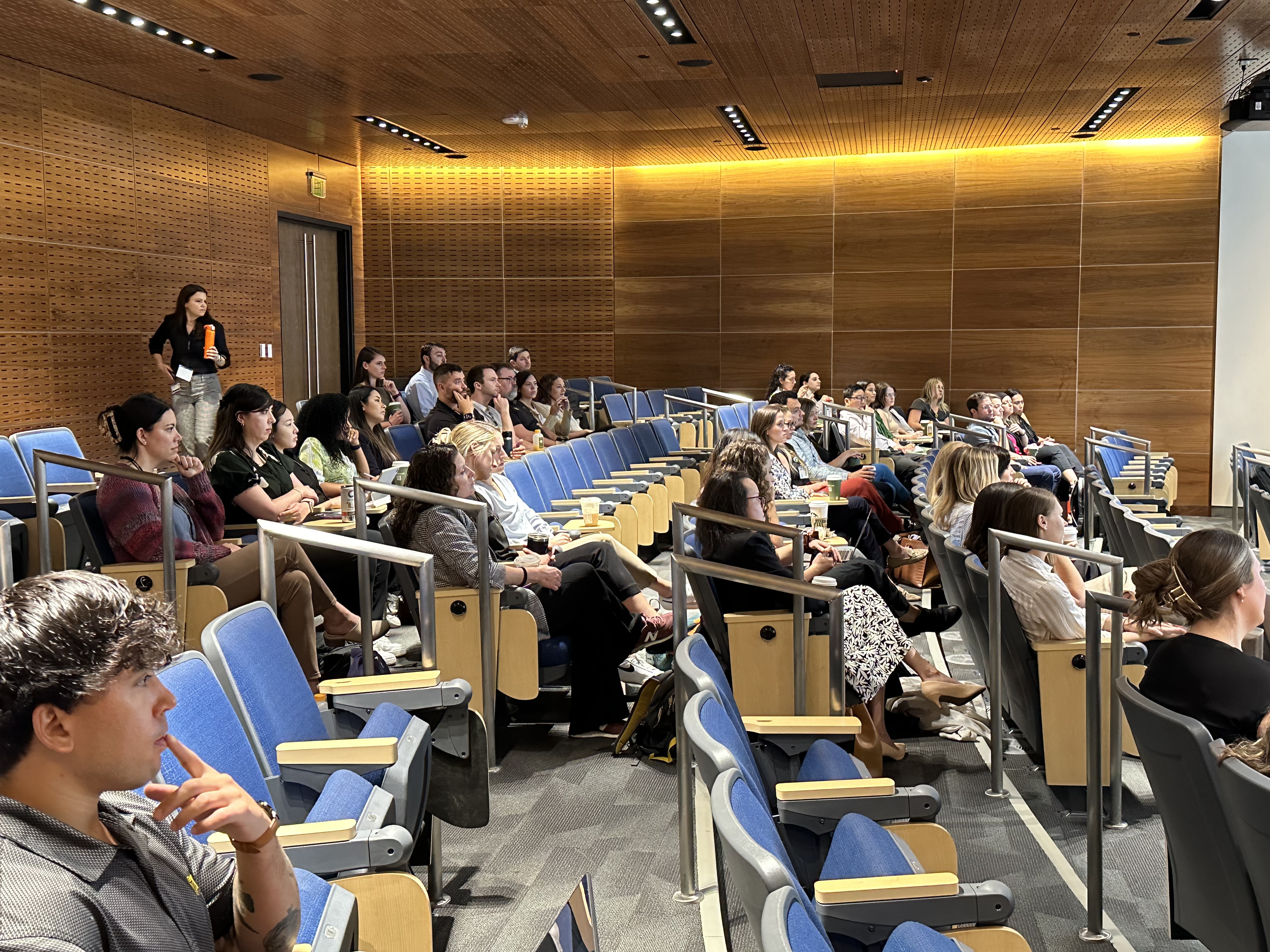 CHP Auditorium filled with students and faculty listening to a presentation