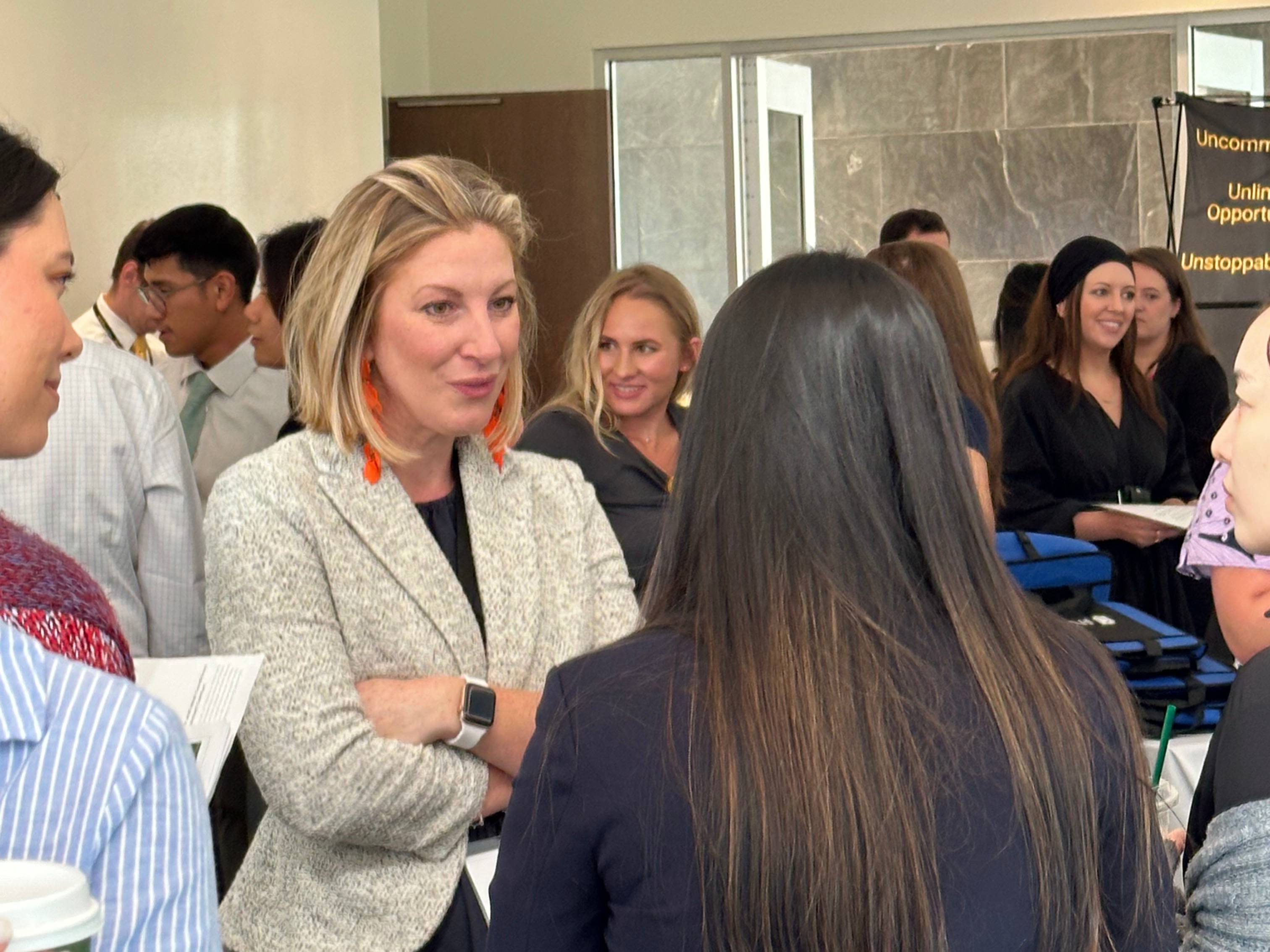 Students and faculty networking at professional development day.