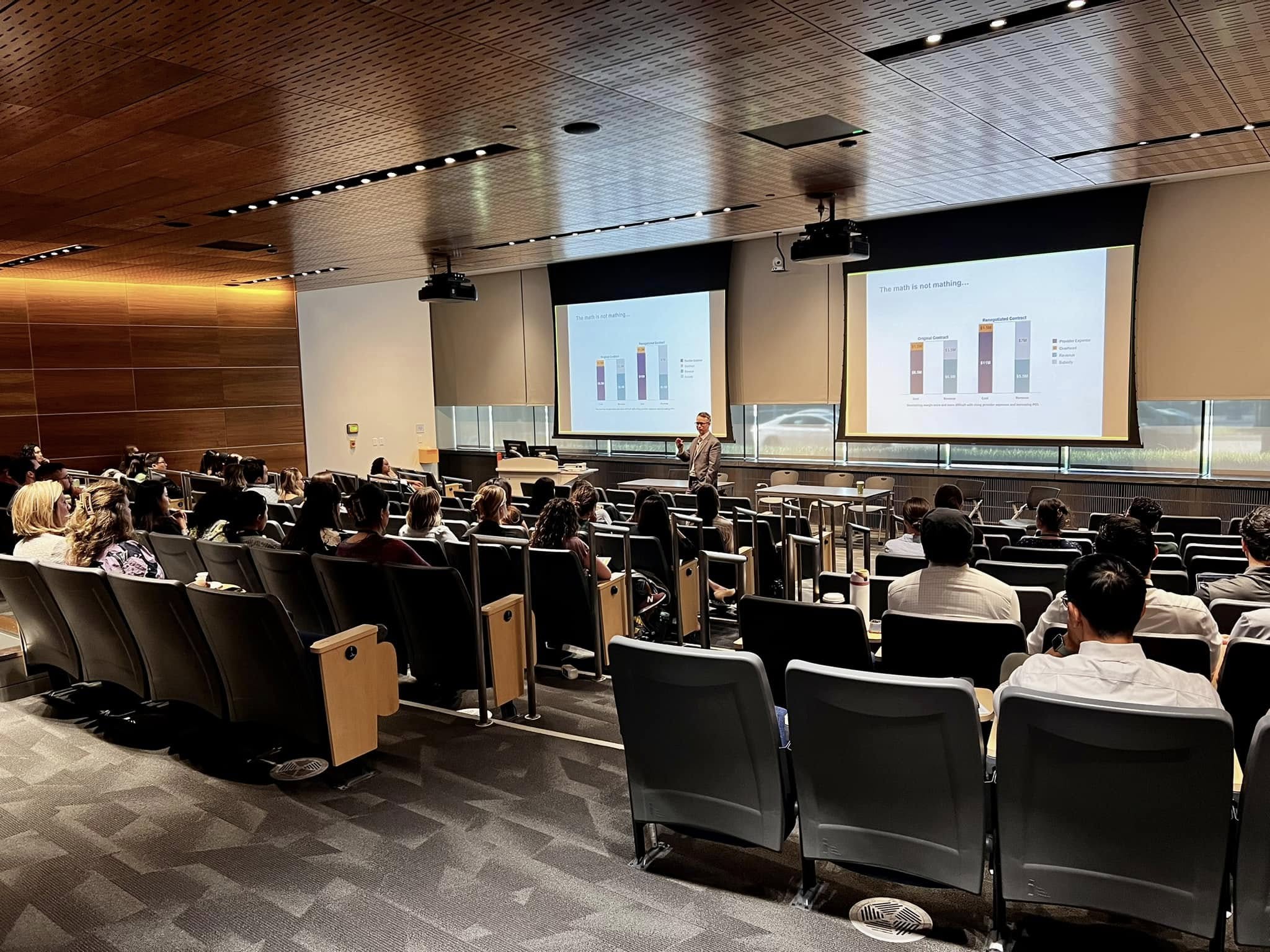 CHP auditorium filled with participants listening to a presentation