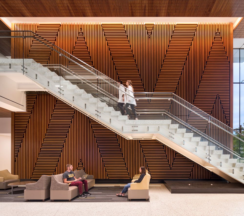 Staircase in CHP lobby with students walking up